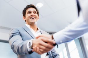 Handshake of businessmen greeting each other
