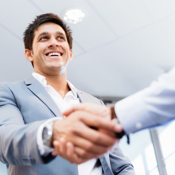 Handshake of businessmen greeting each other